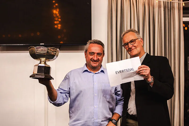 An Evertsdal member holding up a trophy at the awards evening